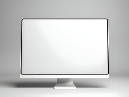 Clean image of a white computer monitor with a blank screen, perfect for showing your design or website.の写真素材