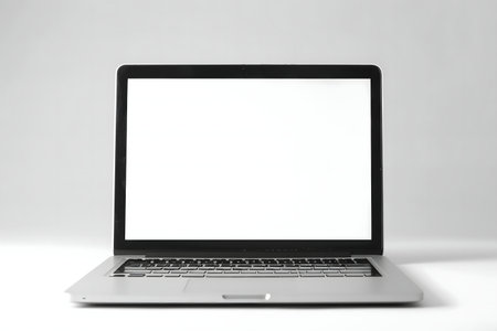 A modern laptop with a blank white screen, perfect for showcasing your app or design.