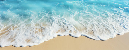 Stunning beach scene with crystal-clear turquoise water gently lapping the white sand.