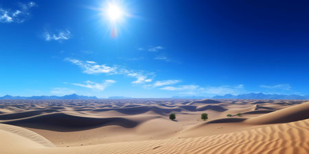 A breathtaking panoramic view of a vast desert, dunes stretching to the horizon under a vibrant blue sky.の写真素材