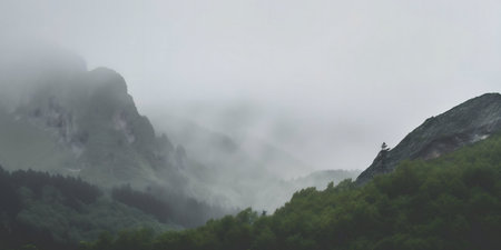 Misty mountains shrouded in fog, creating a serene and mysterious atmosphere.の写真素材