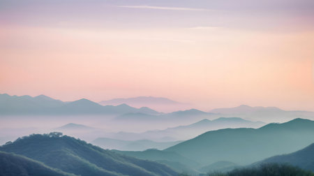 Serene sunrise over misty mountains. Peaceful landscape.の写真素材