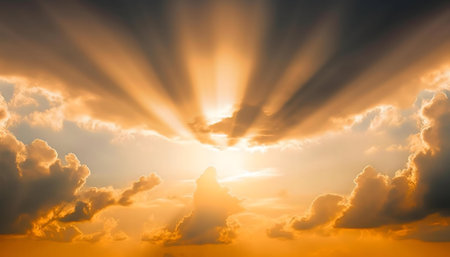 Stunning sunset with radiant sun rays piercing through dramatic clouds. Golden hour, peaceful scene.の写真素材