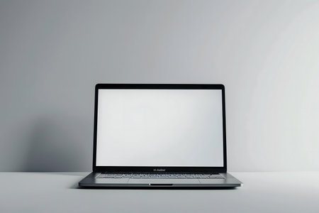 Clean image of a laptop with a blank screen against a simple gray background. Perfect for mockups.の写真素材