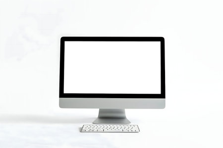 A modern, minimalist computer with a blank screen and wireless keyboard on a white background.
