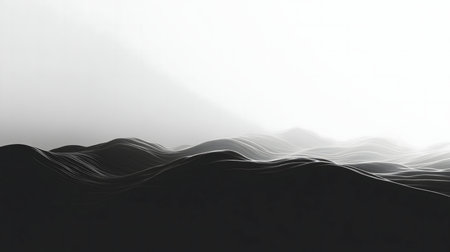 A grayscale image of rolling hills, bathed in soft light creating a serene and calm mood.の写真素材