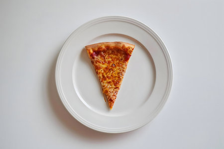 A solitary slice of pizza, cheese, rests on a pristine white plate.