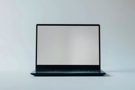 A sleek, modern laptop with a blank screen on a minimalist background.の写真素材