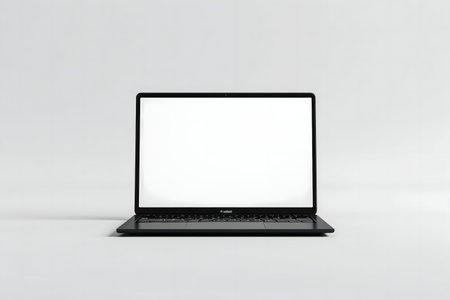 A clean shot of a black laptop with a blank screen on a white background. Perfect for mockups.の写真素材