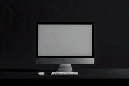 A sleek, modern computer setup. Minimalist aesthetic, dark background.の写真素材