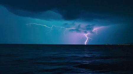 A breathtaking image of a powerful lightning storm over the ocean at night.