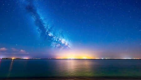 Stunning night scene with the Milky Way galaxy reflected in a calm body of water.