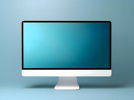 A sleek white all-in-one desktop computer with a teal screen on a light blue background.の写真素材