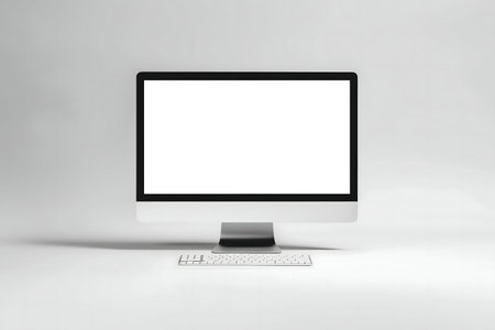 Clean image of a modern computer setup. Blank screen and keyboard.の写真素材