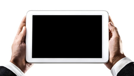 Close-up of two hands holding a white tablet PC with a blank screen against a white background.