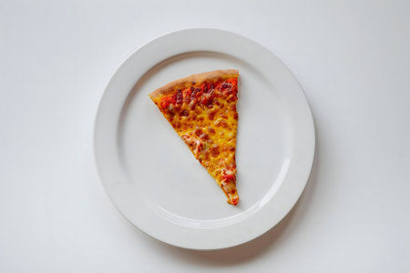 One pizza slice on white plateの写真素材