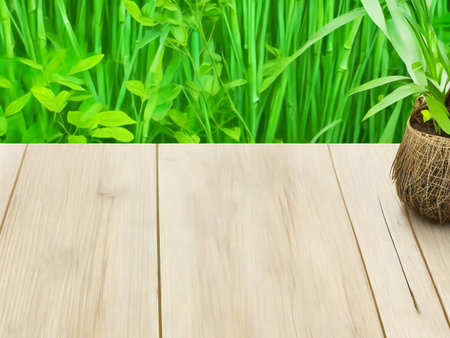 A wooden tabletop with a vibrant green background of bamboo and grass. Perfect for relaxation.の写真素材