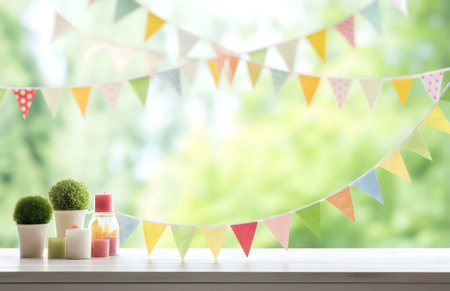 A cheerful window sill scene with colorful bunting, candles, and potted plants. Perfect for spring or summer celebrations.の写真素材