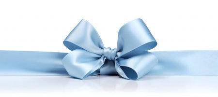 A light blue satin ribbon tied in a beautiful bow. Perfect for gifts or decorations.の写真素材