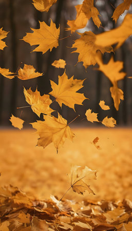 Golden autumn leaves falling gracefully. A beautiful autumn scene.の写真素材