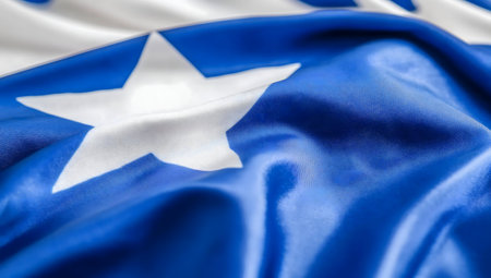 Close-up of a blue flag with a white star.の写真素材