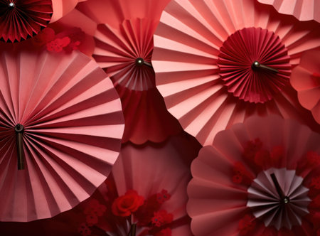 Paper fans with red flowers as background, closeup. Festive decorの写真素材