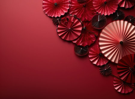 Paper fans on red background, top view. Chinese new year conceptの写真素材