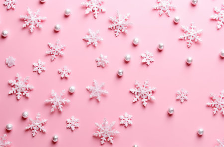 White snowflakes on pink background, top view. Christmas background