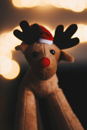 Christmas reindeer toy on bokeh background. Christmas and New Year concept