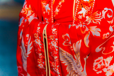 Chinese traditional costume, closeup of a red garment.の写真素材