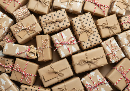 Pile of gift boxes with christmas ornaments as backgroundの写真素材