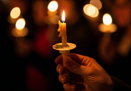 Candle light in the church, shallow depth of field, focus on candleの写真素材
