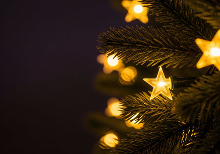 christmas tree with golden lights and bokeh on black background