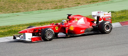 BARCELONA, SPAIN - FEBRUARY 18, 2011: Fernando Alonso of Ferrari team driving his F1 car during Formula One Teams Test Days at Catalunya circuit.のeditorial素材