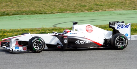 BARCELONA, SPAIN - FEBRUARY 18, 2011: Kamui Kobayashi of Sauber team driving his F1 car during Formula One Teams Test Days at Catalunya circuit.のeditorial素材