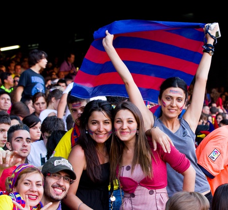 BARCELONA, SPAIN - MAY 13, 2011: Unidentified FC Barcelona supporters celebrate the Spanish League Championship victory in Camp Nou stadium.のeditorial素材