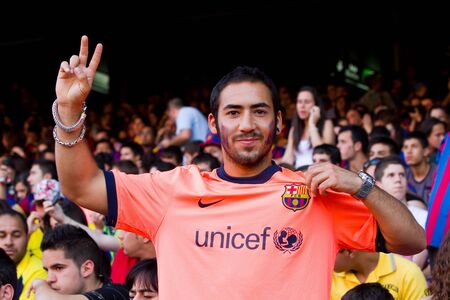 BARCELONA, SPAIN - MAY 13, 2011: Unidentified FC Barcelona supporters celebrate the Spanish League Championship victory in Camp Nou stadium.のeditorial素材