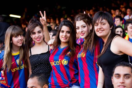 BARCELONA, SPAIN - MAY 13, 2011: Unidentified FC Barcelona supporters celebrate the Spanish League Championship victory in Camp Nou stadium.のeditorial素材