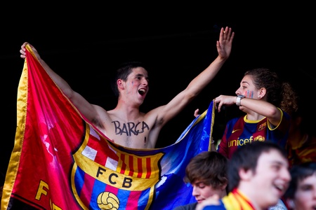 BARCELONA, SPAIN - MAY 13, 2011: Unidentified FC Barcelona supporters celebrate the Spanish League Championship victory in Camp Nou stadium.のeditorial素材