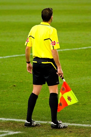 BARCELONA, SPAIN - DECEMBER 13, 2010: Unidentified referee in action during the Spanish League match between FC Barcelona and Real Sociedad, 5 - 0, in Camp Nou stadium.のeditorial素材