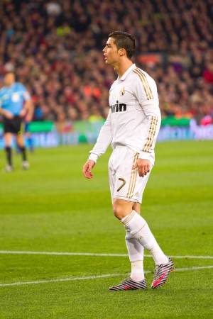 BARCELONA - JANUARY 25, 2012: Cristiano Ronaldo of Madrid in action during the Spanish Cup match between FC Barcelona and Real Madrid, final score 2 - 2, on January 25, 2012, in Camp Nou, Barcelona, Spain.のeditorial素材