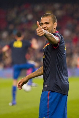 BARCELONA - JANUARY 4: Dani Alves of Barcelona in action during the Spanish Cup match between FC Barcelona and Osasuna, final score 4 - 0, on January 4, 2012 in Camp Nou stadium, Barcelona, Spainのeditorial素材