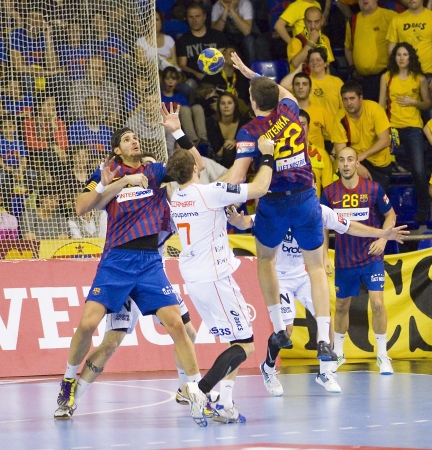 BARCELONA - MARCH 25: Some players in action during EHF Champions League match between FC Barcelona and Montpellier, final score 36-20, on March 25, 2012, in Palau Blaugrana, Barcelona, Spainのeditorial素材