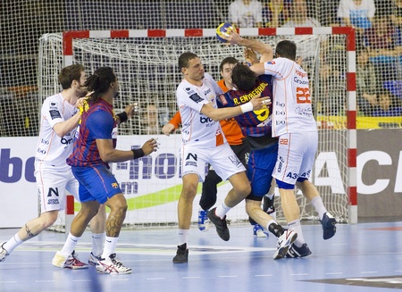 BARCELONA - MARCH 25: Some players in action during EHF Champions League match between FC Barcelona and Montpellier, final score 36-20, on March 25, 2012, in Palau Blaugrana, Barcelona, Spainのeditorial素材