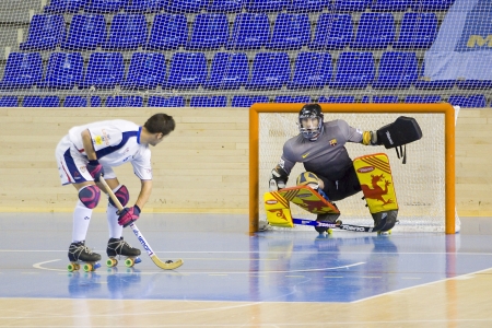 BARCELONA - JANUARY 26: Oriol Vives of IHC and Eitor Egurrola of FCB in action at Spanish OK League match between FC Barcelona and Igualada HC, final score 4-5, on January 26, 2013, in Palau Blaugrana, Barcelona, Spainのeditorial素材