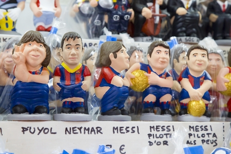 Caganers, originally a character in Catalan mythology, now portraying famous celebrities or characters on sale at Santa Llucia Fair, on December 1, 2013, in Barcelona, Spainのeditorial素材