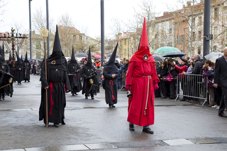 People at Procession de la Sanch, an annual ceremony in several towns of Southern Europe during...