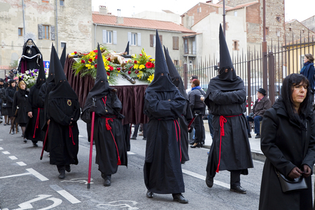 People at Procession de la Sanch, an annual ceremony in several towns of Southern Europe during Easter Holy Week, on March 25, 2016, in Perpignan, Franceのeditorial素材