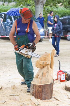 Wood sculpture competition with chainsaw, on July 27, 2019, in Alella, Barcelona, Spain.のeditorial素材
