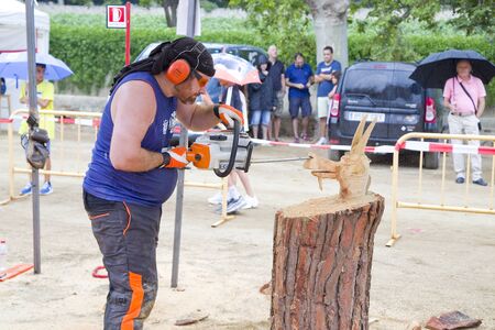 Wood sculpture competition with chainsaw, on July 27, 2019, in Alella, Barcelona, Spain.のeditorial素材
